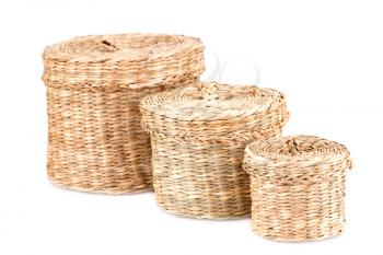 Three wicker boxes isolated on white background.