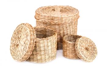 Three wicker boxes isolated on white background.