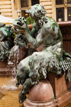 The figurine at the statue of Hygieia the goddess of health and hygiene n the courtyard of Hamburg City Hall (Rathaus), Germany.