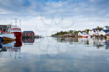 The view of the fisherman village Sorvagen with typical rorbu houses and boats in Lofoten islands, Norway.