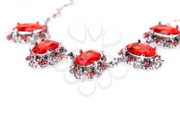 Stylish necklace with red stones isolated on a white background.