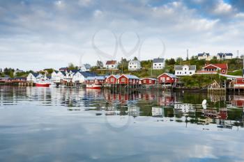 The view of the fisherman village Sorvagen with typical rorbu houses and boats in Lofoten islands, Norway.