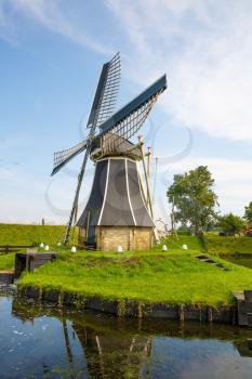 The windmill in the traditional old fisherman village open-air museum of Zuiderzee (Zuiderzeemuseum), Enkhuizen, Netherlands.