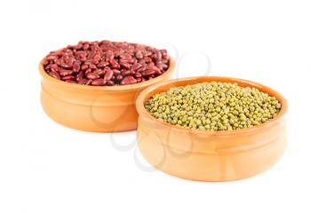 Red kidney and mung beans in the ceramic pots isolated on a white background.