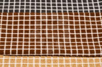 Brown, black and beige towels texture as a background.
