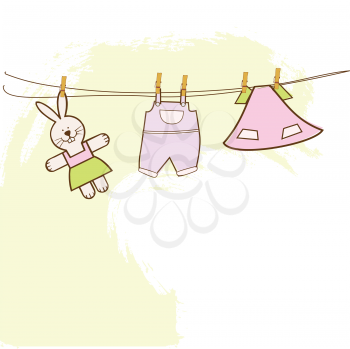 Royalty Free Clipart Image of Baby Clothes and a Bunny Hanging on a Line