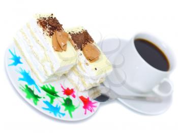 Sponge cake and on original decorating plate with cup of coffee. Isolated