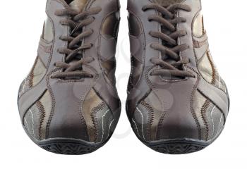 Pair of leather brown sneakers.  Isolated over white.