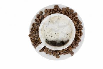 Cup of hot coffee on a white plateau and grains of coffee. Isolated.