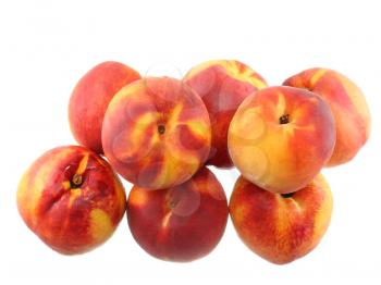 A heap of peaches with cutting of one, on white background. Isolated