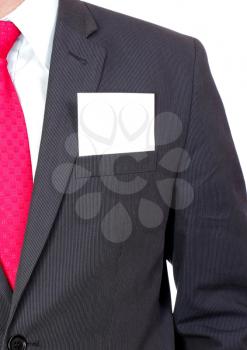 Fragment of businessman black suit with blank card . Isolated over white