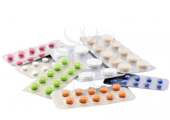 Coloured pills on white background. Isolated over white