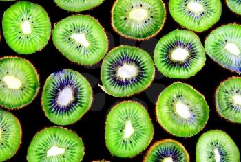 Abstract  slice of kiwi on black background(as wallpaper or backdrop).