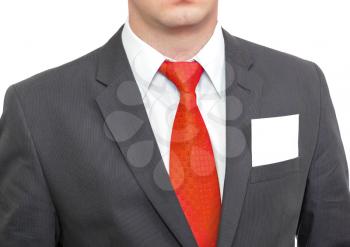 Fragment of businessman black suit with blank card . Isolated over white