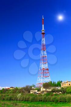Big television transmitter and landscape view of the Caucasus Mountains.