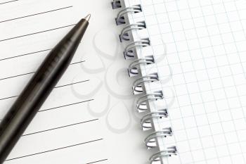 Notebook pages with pen. Isolated over white