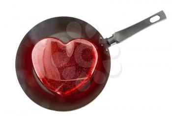 Frying pan with the big red heart. Isolated