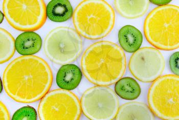 Background texture-fruit mix: lemon, orange, kiwi on white background. Close-Up. Isolated.