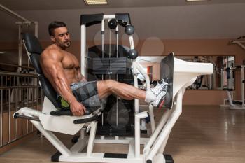 Bodybuilder Doing Heavy Weight Exercise For Legs