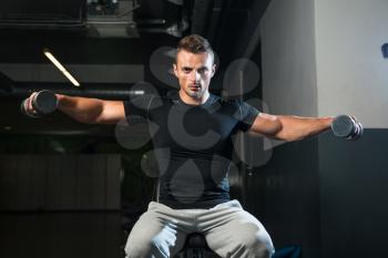Bodybuilder Doing Exercise For Shoulder