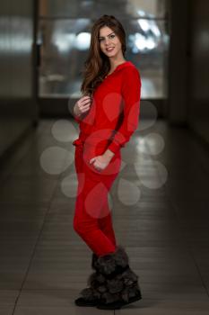 Beautiful Woman Wearing Fashion Track Suit In Red