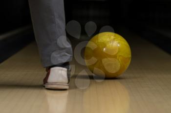 Bowling Ball Next To The Foot