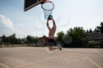 Basketball Player Bodybuilder Practicing And Posing For Basketball And Sports Athlete Concept