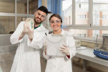 Group Of High School Students Working Together At Laboratory Class