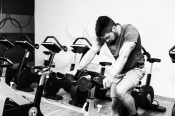 Man In The Gym - Exercising His Legs Doing Cardio Training On Bicycle