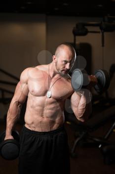 Man Working Out Biceps In A Dark Gym - Dumbbell Concentration Curls