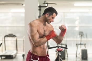 Handsome Man In Red Boxing Gloves - Boxing In Gym - The Concept Of A Healthy Lifestyle - The Idea For The Film About Boxing
