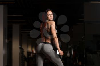 Portrait Of A Young Physically Fit Woman Showing Her Well Trained Body - Beautiful Athletic Fitness Model Posing After Exercises