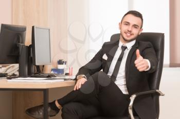 Happy Smiling Cheerful Business Man With Thumbs Up Gesture