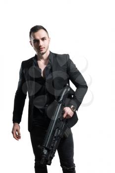 Man Isolated on a White Background With a Handgun as He Turns and Aims Off Camera
