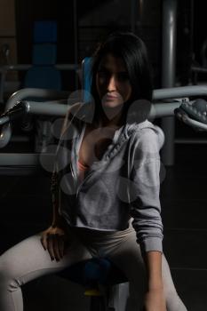 Pretty Good Looking And Attractive Young Woman With Muscular Body Relaxing Or Resting In Gym
