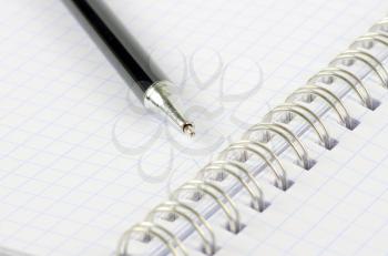 Open notebook with a pen