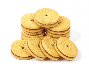Stacks of cookies on white background