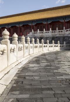 Stone Walkway leading to temple in China's forbidden City with blue sky in background 