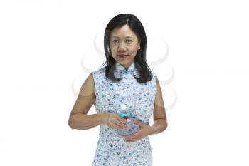 Asian women holding mixed drink while wearing causal light dress on white background