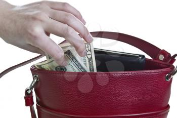 Money being taken out of red purse on white background