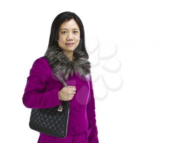 Asian woman wearing jacket with black purse over shoulder on white background