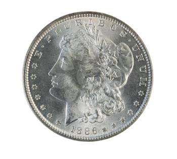 Closeup photo of a Morgan Silver Dollar, obverse side, isolated on white  