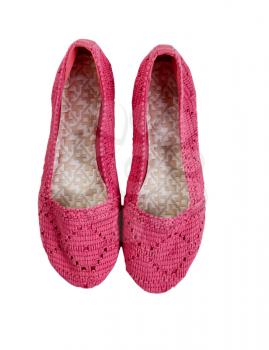 Knitted pink shoes isolated on white. 