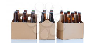 Three generic brown carriers of six pack of glass bottled beer isolated on white with reflection