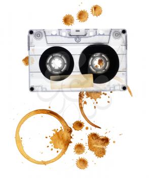 Vintage audio tape with coffee stains. Isolated on white background.