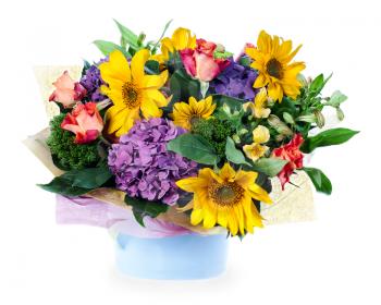 colorful floral bouquet of roses, lilies, sunflowers and irises centerpiece in vase isolated on white background