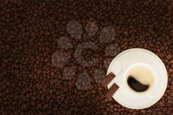 cup of coffee with chocolate pieces on coffee beans background
