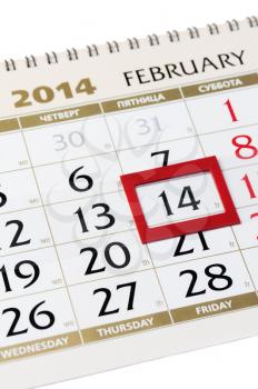 Calendar page with red frame on February 14 2014. Closeup.