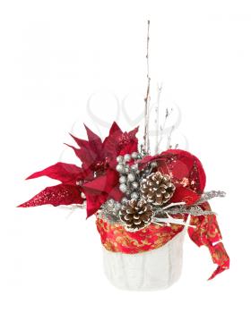 Composition from Poinsettia Plant with branches, pine cones, ribbons and balloons in vase isolated on white background. Closeup.