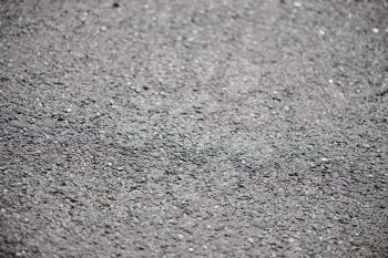  Horizontal view of new asphalt road. Close-up. Shallow depth of field.